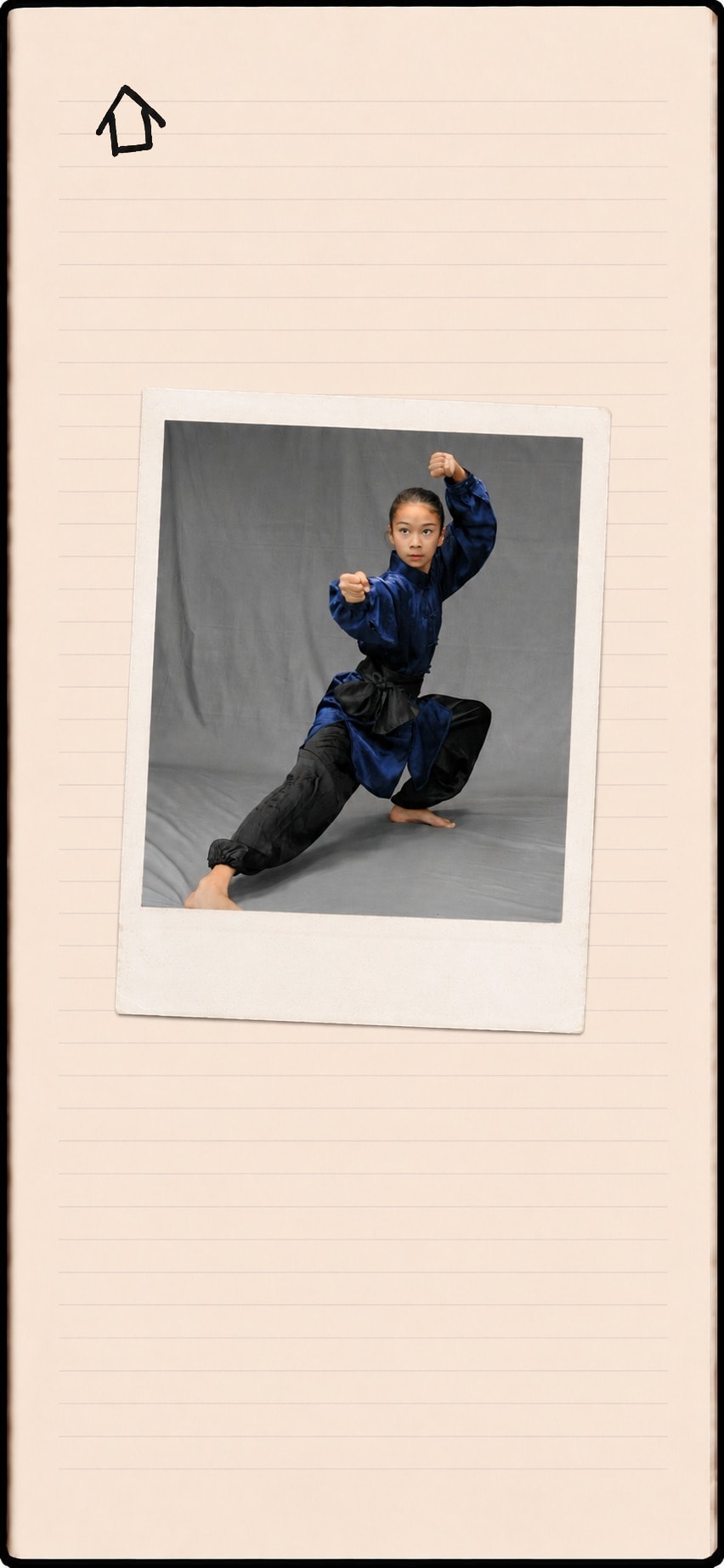 A taped-in polaroid of Blythe in a kung fu stance, wearing a blue and black uniform. A small home drawing in the corner links back home.